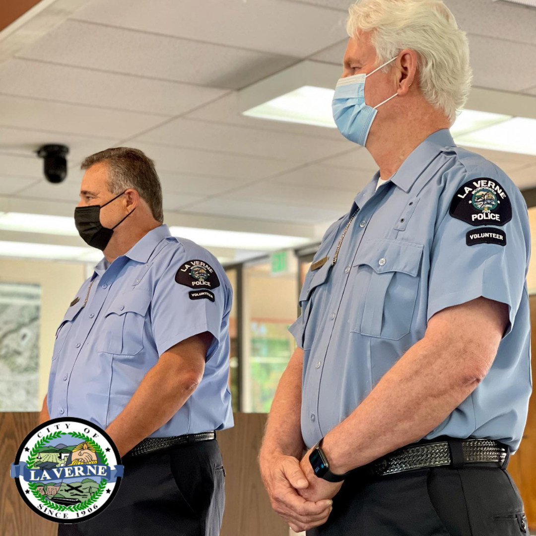 RSVPs standing in Council chambers, wearing masks